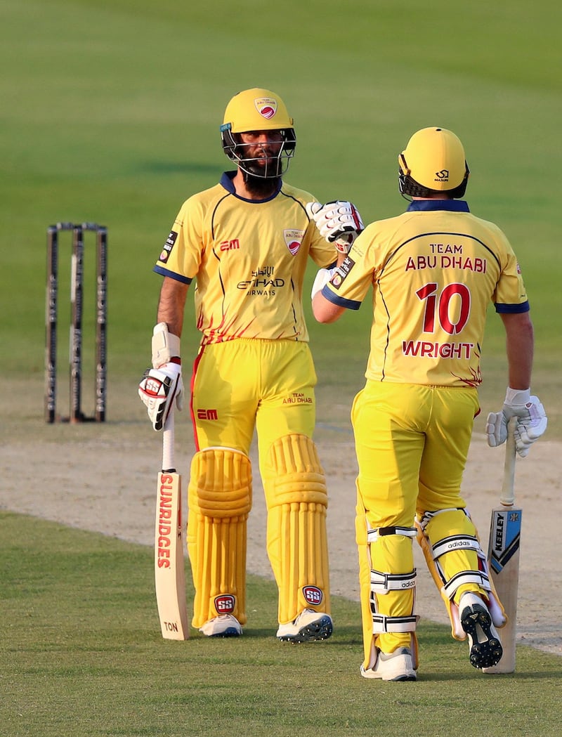 Abu Dhabi, United Arab Emirates - November 17, 2019: Abu Dhabi's Luke Wright and Moeen Ali during the game between Team Abu Dhabi and The Northern Warriors in the Abu Dhabi T10 league. Sunday the 17th of November 2019. Zayed Cricket Stadium, Abu Dhabi. Chris Whiteoak / The National