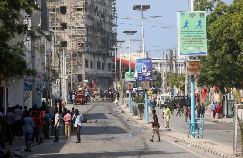 A general view shows people at the scene of a suicide car explosion at a checkpoint near the Somali Parliament building in Mogadishu, Somalia June 15, 2019 REUTERS/Feisal Omar