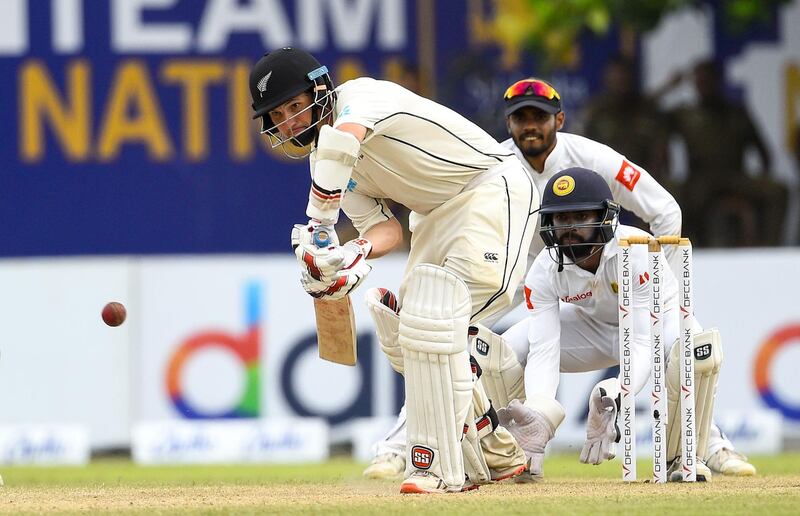 New Zealand's cricketer BJ Watling (L) plays a shot as Sri Lanka's wicketkeeper Niroshan Dickwella (R) looks on during the third day of the opening Test cricket match between Sri Lanka and New Zealand at the Galle International Cricket Stadium in Galle on August 16, 2019. / AFP / ISHARA S. KODIKARA
