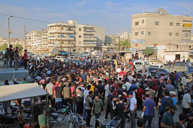 Syrians take part in the funeral of 10 fighters with the Turkey-backed Faylaq Al Sham rebel faction in Syria. AFP