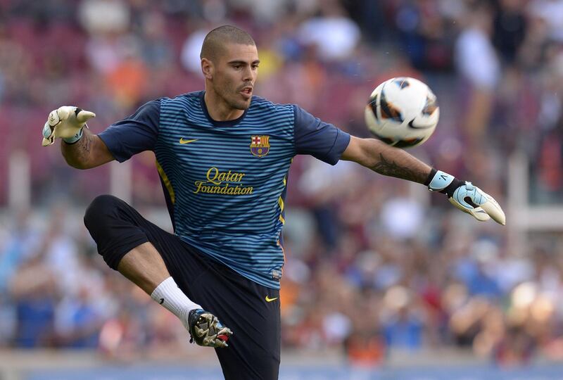 Barcelona's goalkeeper Victor Valdes controls a ball before the Spanish league football match FC Barcelona vs Malaga CF at the Camp Nou stadium in Barcelona on June 1, 2013.   AFP PHOTO/ LLUIS GENE
 *** Local Caption ***  246069-01-08.jpg