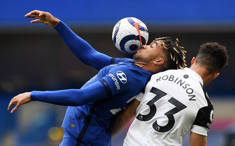 Chelsea's Reece James controls the ball under pressure from Antonee Robinson of Fulham. EPA