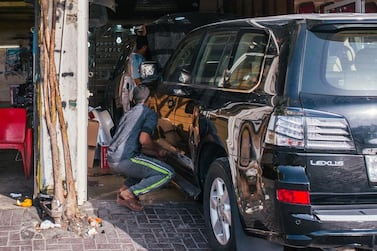 A lost cost repair car garage in Sharjah. Alex Atack for The National.