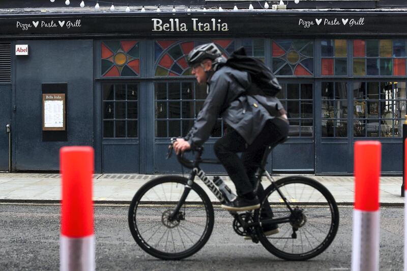 A cyclist passes a closed Bella Italia restaurant, operated by Casual Dining Group Ltd., in London, U.K., on Thursday, July 9, 2020. British shops aren't getting much of a boost from newly reopened bars, cafes and restaurants as customers prefer to stay away. Photographer: Simon Dawson/Bloomberg