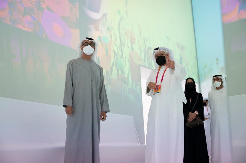 Sheikh Mohamed bin Zayed, Crown Prince of Abu Dhabi and Deputy Supreme Commander of the Armed Forces, visits the Qatar pavilion at Expo 2020 Dubai. With him are (back R) Sheikh Mohammed bin Hamad bin Tahnoon, Chairman of the Board of Directors of Abu Dhabi Airports, and Reem Al Hashimy, Minister of State for International Co-operation and director general of Expo 2020 Dubai. All photos: Hamad Al Kaabi  / Ministry of Presidential Affairs