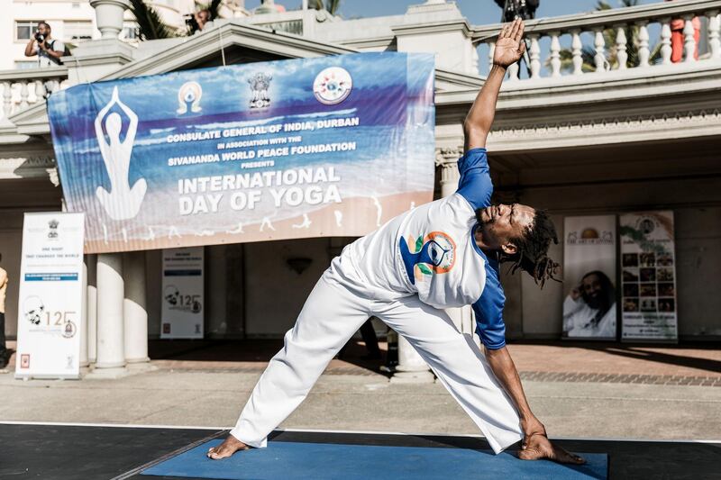 A yoga instructor takes part in a yoga session at North Beach in Durban, South Africa.  Rajesh Jantilal / AFP