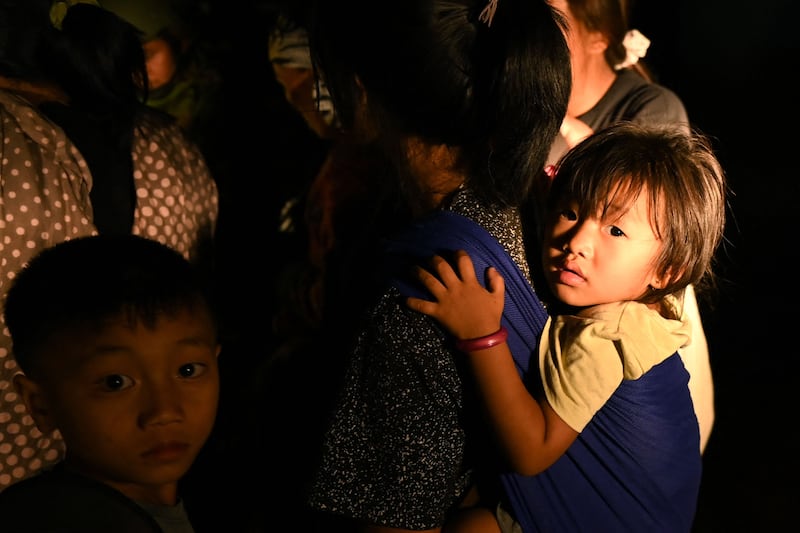 Many women and children were among those who fled. AFP
