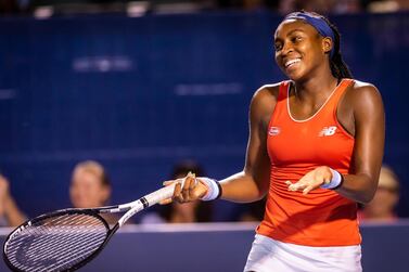 Cori "Coco" Gauff, of the United States, jokes around during an exhibition match against Ashleigh Barty, of Australia, at the Winston-Salem Open tennis tournament Wednesday, Aug. 21, 2019, in Winston-Salem, N.C. Gauff won the match in a super tie break 6-4, 2-6 (10-8). (Andrew Dye/The Winston-Salem Journal via AP)
