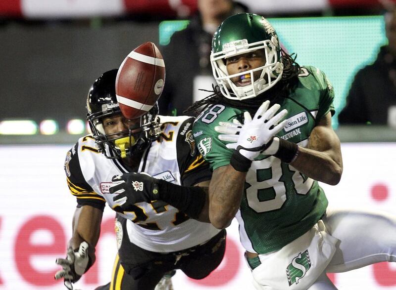 The Hamilton Tiger-Cats Delvin Breaux breaks up a pass to the Saskatchewan Roughriders Taj Smith. David Stobbe / Reuters