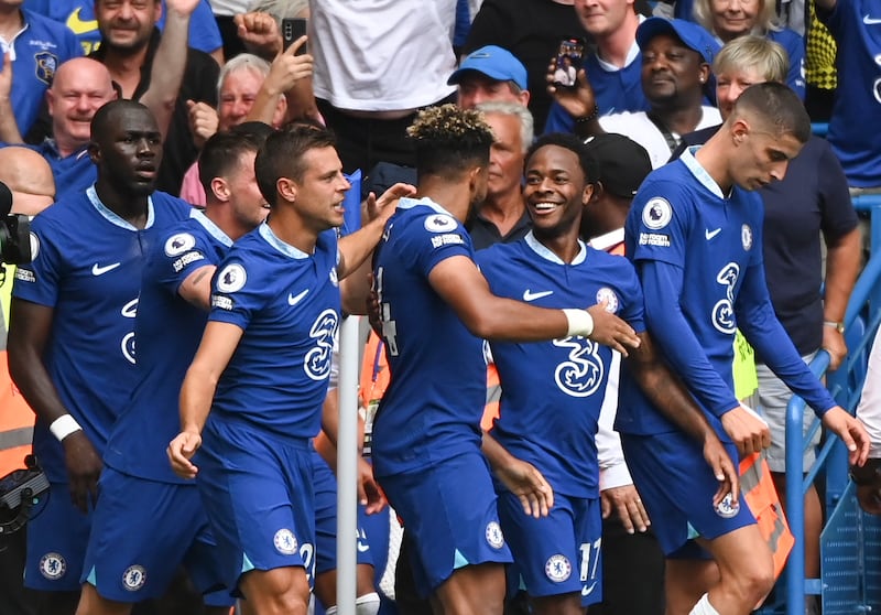 Reece James celebrates with teammates after scoring the second for Chelsea. EPA