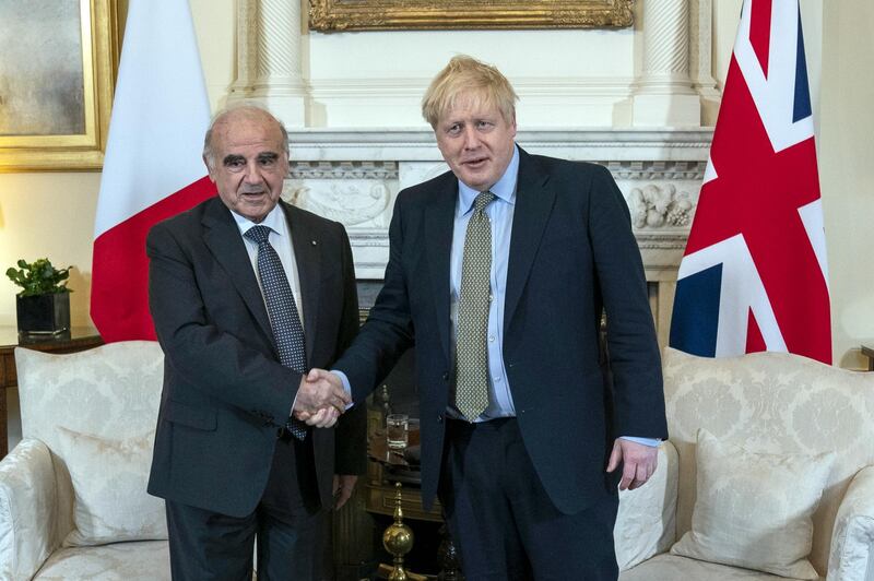 Boris Johnson, U.K. prime minister, right, shakes hands with George Vella, Malta's president, during their bilateral meeting inside number 10 Downing Street in London, U.K., on Thursday, March 5, 2020. Malta was hit by a scandal earlier in the year that shone an uncomfortable light on the European Union’s smallest member, one whose central banker nevertheless shares a seat at the table with the likes of Germany and France setting the euro-area’s monetary policy. Photographer: Will Oliver/EPA/Bloomberg