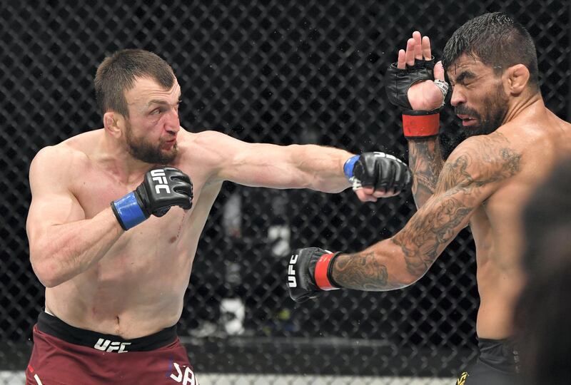 ABU DHABI, UNITED ARAB EMIRATES - JULY 12: (L-R) Muslim Salikhov of Russia punches Elizeu Zaleski dos Santos of Brazil in their welterweight fight during the UFC 251 event at Flash Forum on UFC Fight Island on July 12, 2020 on Yas Island, Abu Dhabi, United Arab Emirates. (Photo by Jeff Bottari/Zuffa LLC)