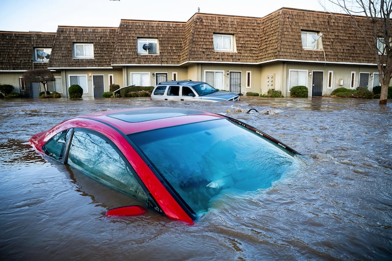 After days of rain, Bear Creek in Merced, California, overflowed its banks, flooding dozens of homes and vehicles. AP