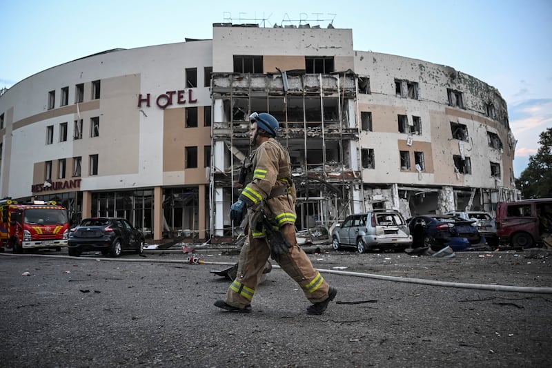 Firefighters work at the scene where a hotel was damaged by Russian missile fire in Zaporizhzhia. Reuters