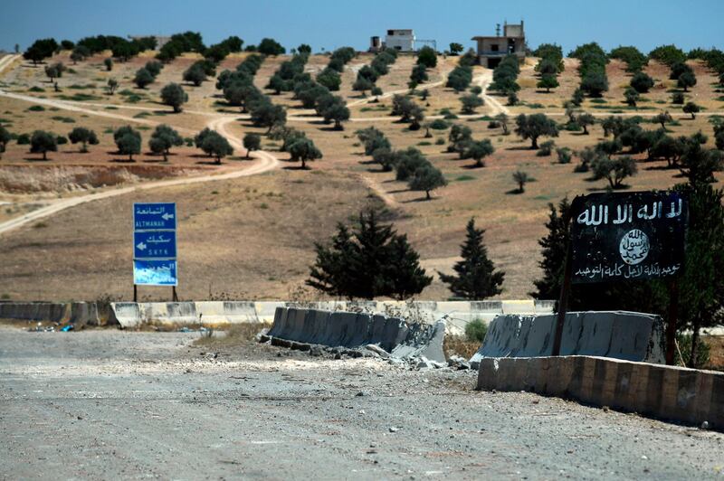 A sign erected by the Islamic State group is seen in Khan Sheikhun.