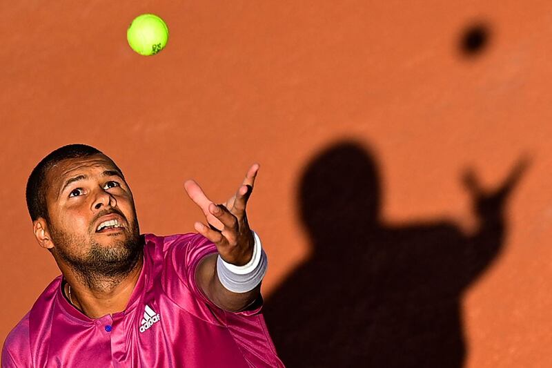 French player Jo-Wilfried Tsonga serves during his win over Japan's Yoshihito Nishioka in their French Open first-round match at Roland Garros in Paris on May 31, 2021. AFP