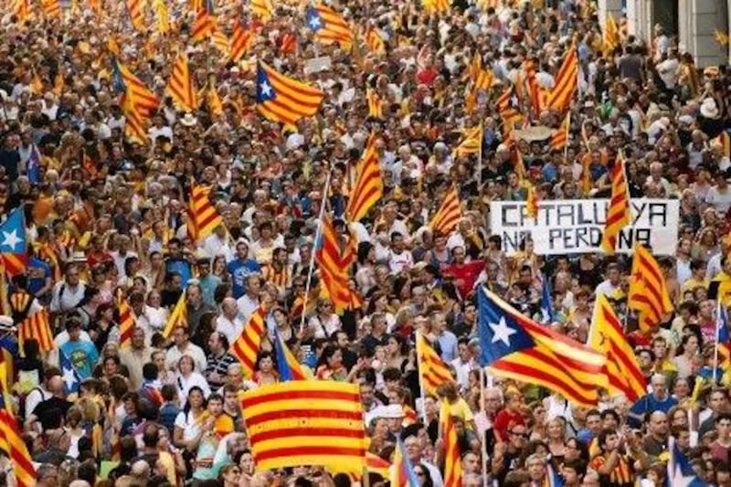 Protesters wave Catalan flags as they march in favour of regional independence as they protest against the Spanish government's tax laws during the National Day of Catalonia in Barcelona last week.
