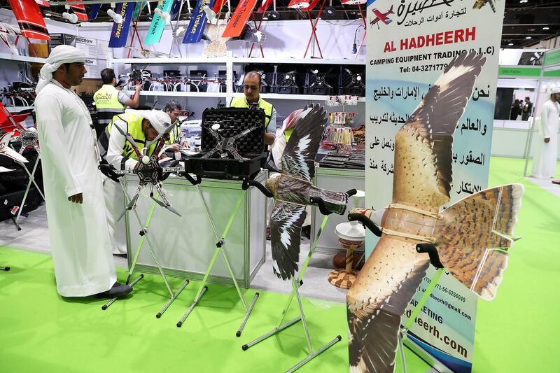 ABU DHABI ,  UNITED ARAB EMIRATES , AUGUST 27 – 2019 :- Visitors looking at the hunting items during the ADIHEX 2019 held at ADNEC in Abu Dhabi. ( Pawan Singh / The National ) For News/Online/Instagram/Big Picture. Story by Daniel 