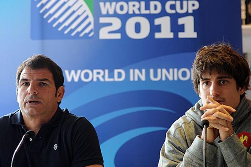 France's fly half David Skrela (R) and head coach Marc Lievremont give a press conference in Auckland on September 14 , 2011 during the 2011 Rugby World Cup. France fly-half David Skrela will miss the rest of the World Cup after sustaining a bad shoulder injury in the opener against Japan, coach Marc Lievremont announced. AFP PHOTO / FRANCK FIFE

