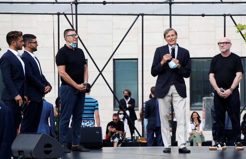Scientific Director of Humanitas, Alberto Mantovani, speaks next to Italian designers Domenico Dolce and Stefano Gabbana and the band Il Volo at the end of the Spring / Summer 2021 men's collection in a live-streamed show during Milan Digital Fashion Week. Reuters