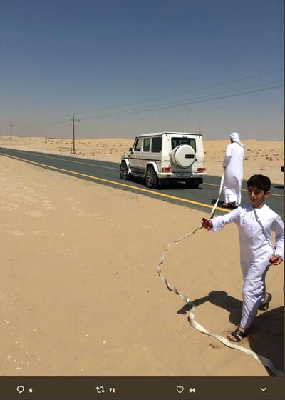 Hanna shared this image of Sheikh Mohammed's companions helping to tether her car to his famous white G-Wagen and pull them out of the sand. Courtesy: Hanna Karen Arroyo