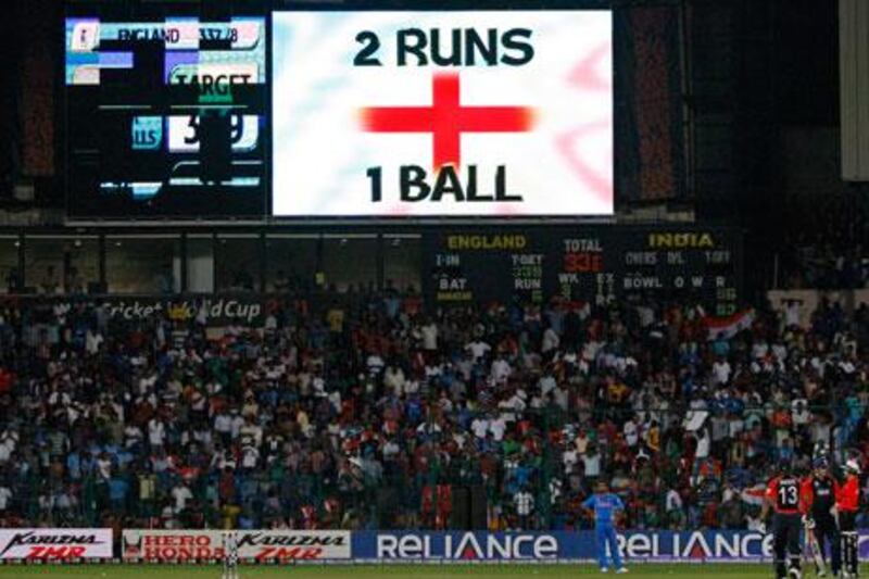 A scoreboard shows the required two balls from one run required for England to win against India.