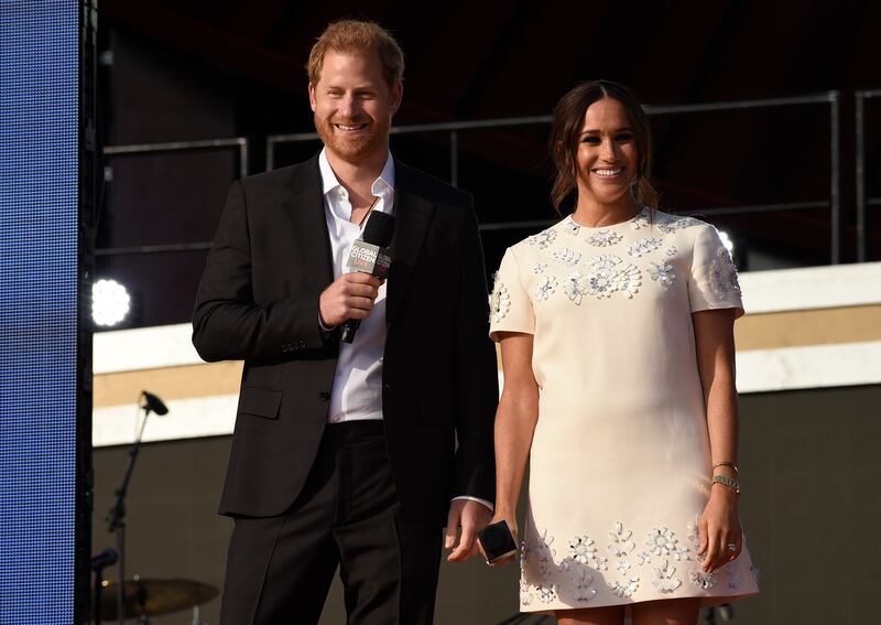 Prince Harry, the Duke of Sussex, and Meghan, the Duchess of Sussex, are urging G20 leaders to issue doses as swiftly as possible. Invision / AP