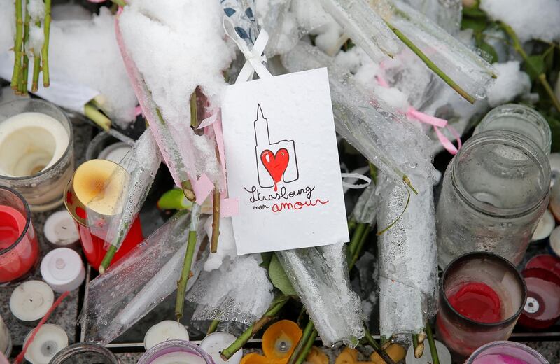 A drawing representing Strasbourg's cathedral is seen at the improvised memorial. Reuters