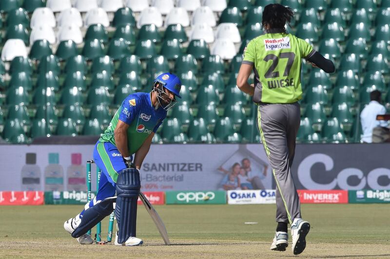 Lahore Qalandars' Shan Masood, right,) celebrates the wicket of David Wiese. AFP