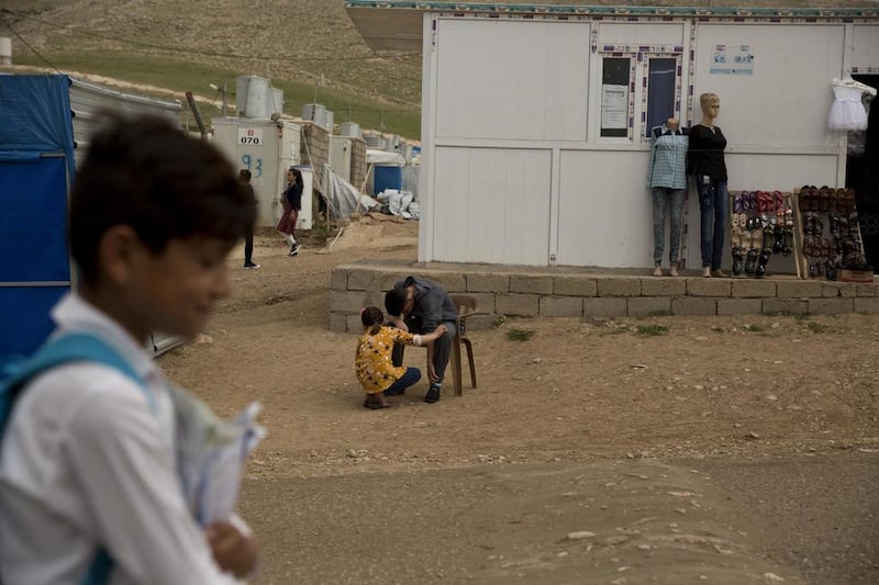 Ahmed with his sister, Manal. He now lives at the Esyan Camp in Iraq with his mother, sister and brother — the only surviving members of his family.