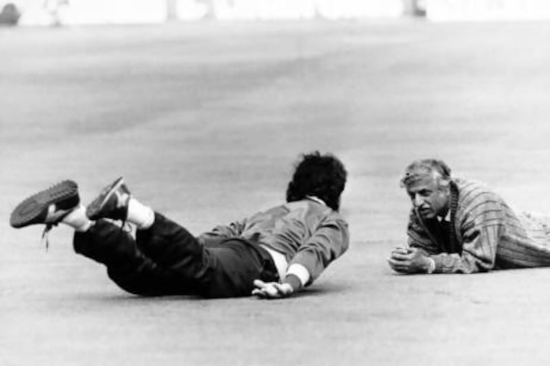 Hasseb Ahsan, right, works with Pakistan captain Imran Kan during a training session at Lord's in England during a tour in 1987. PA
