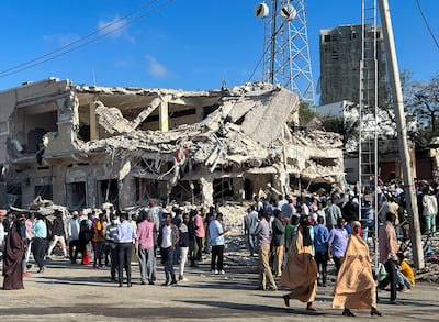 People gather at the site of deadly car bombing carried out by Al Shabab in Mogadishu on October 29.  Reuters