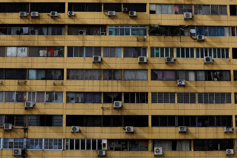Air-conditioning units dot the facade of People's Park Complex condominium in Singapore. Reuters