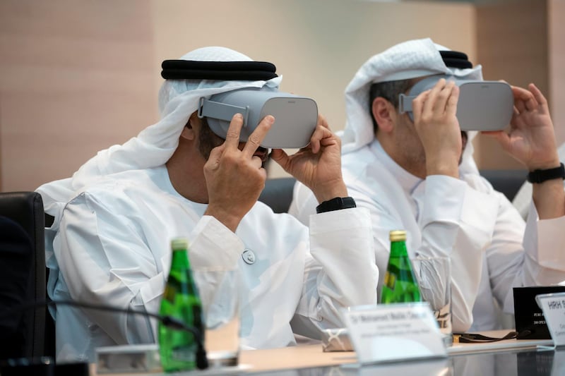 SINGAPORE, SINGAPORE - February 28, 2019: HH Sheikh Mohamed bin Zayed Al Nahyan, Crown Prince of Abu Dhabi and Deputy Supreme Commander of the UAE Armed Forces (L), looks through a virtual reality goggles, during a meeting, at Mubadala's GLOBALFOUNDRIES semiconductor facility. Seen with HE Khaldoon Khalifa Al Mubarak, CEO and Managing Director Mubadala, Chairman of the Abu Dhabi Executive Affairs Authority and Abu Dhabi Executive Council Member (R).
( Ryan Carter for the Ministry of Presidential Affairs )
---