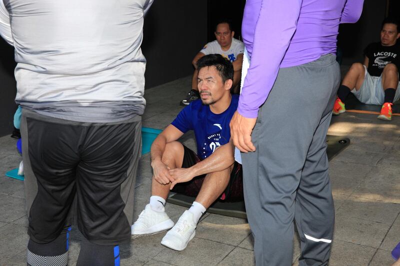 Eight-division boxing champion and Philippine Senator Manny Pacquiao cools down after his regular morning run around his village in Makati City, Metro Manila.