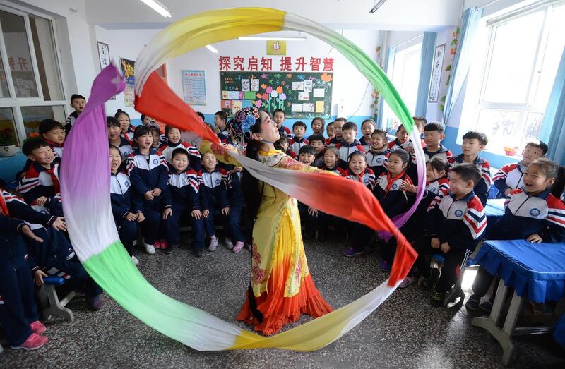 Chinese students celebrate World Theatre Day in their school in Handan City, Hebei Province. EPA