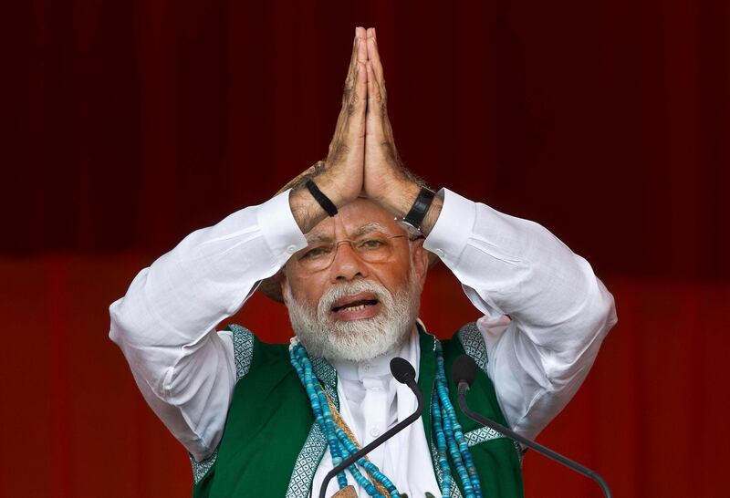 FILE- In this March 30, 2019 file photo, Indian Prime Minister Narendra Modi gestures as he speaks during an election campaign rally of his Bharatiya Janata Party (BJP) in Along, Arunachal Pradesh, India. Modi on Sunday apologized to the countryâ€™s public for imposing the ongoing world's largest lockdown for three weeks, calling it harsh but â€œneeded to winâ€ the battle against coronavirus pandemic. (AP Photo/Anupam Nath, File)