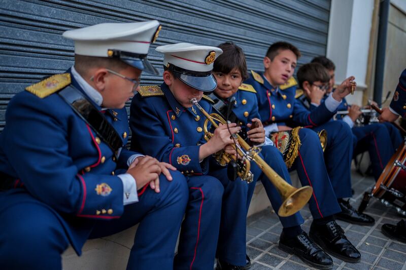 Band members practise prior to the procession at the Veracruz church in Aguilar de la Frontera, southern Spain. AP