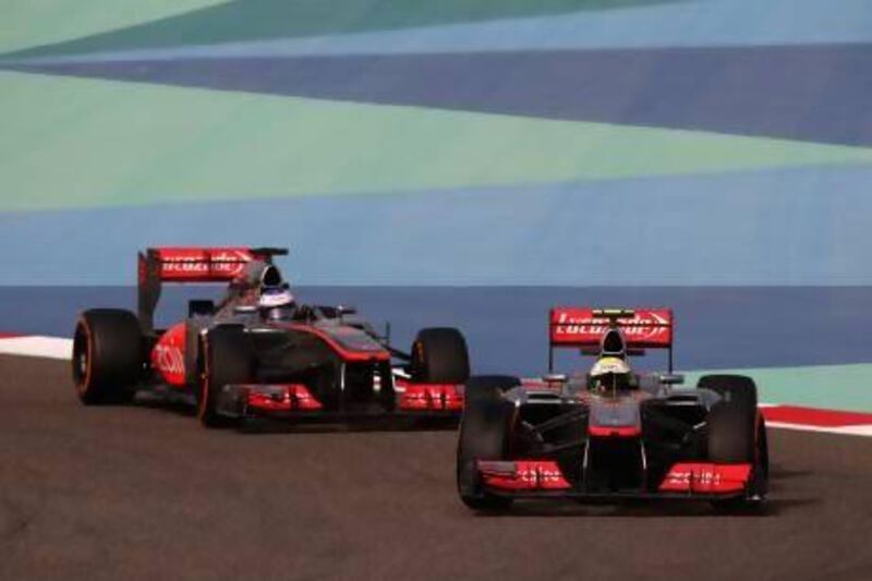 Sergio Perez leads his McLaren-Mercedes teammate Jenson Button at Sunday's Bahrain Grand Prix before the Mexican's over exuberance saw him clip the Englishman's wheels at 300kph. Button described Perez's performance as 'dangerous' and 'dirty'. Clive Mason / Getty Images