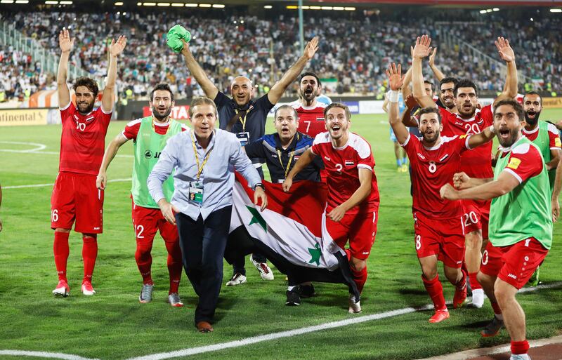 epa06185791 Players of Syria celebrate after the FIFA World Cup 2018 qualifying soccer match between Iran and Syria at the Azadi stadium in Tehran, Iran, 05 September 2017. The match ended 2-2.  EPA/ABEDIN TAHERKENAREH