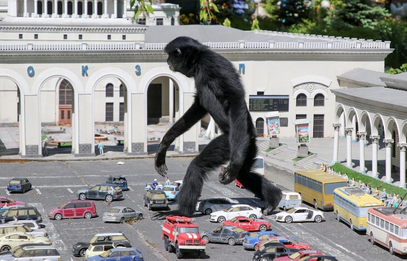 A gibbon strolls across a model street scene at a zoo inside the park of miniatures in Bakhchisaray, Crimea. Reuters