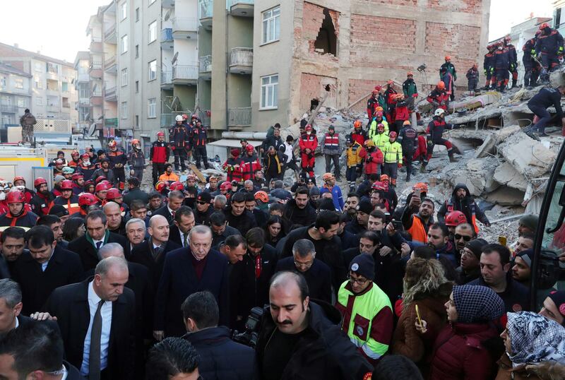 Turkish President Tayyip Erdogan visits a neighborhood hit by an earthquake in Elazig, Turkey. Reuters