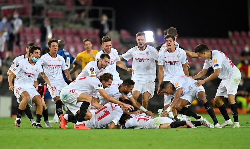 Sevilla players celebrate winning the Europa League. Reuters