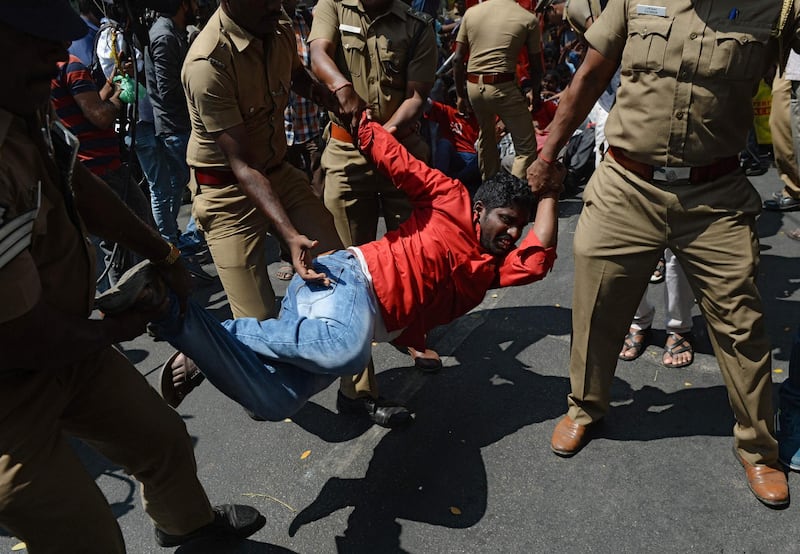 Indian police detain a member of the Revolutionary Students Youth Federation (RSYF) during a protest against the tearing down of a statue of communist leader Vladimir Lenin in Belonia, Tripura state. Arun Sankar / AFP Photo