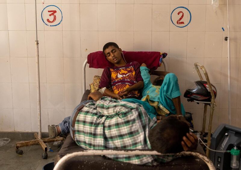 Patients receive treatment inside a Covid-19 ward of a government-run hospital, amid the coronavirus disease  pandemic, in Bijnor district, Uttar Pradesh, India. Reuters