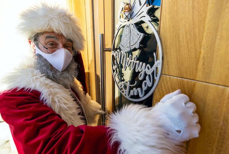 Dubai, United Arab Emirates - December 14, 2020: Lifestyle. Santa played by Keith Dallison. Santa is doing home visits with Covid-19 prevention measures in place and zoom calls to protect the children. Monday, December 14th, 2020 in Dubai. Chris Whiteoak / The National