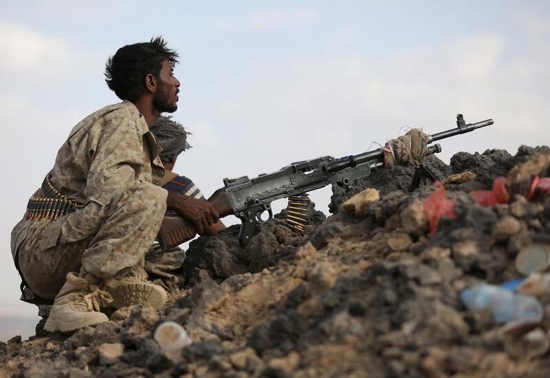 Loyalist fighters man a position in Marib. REUTERS