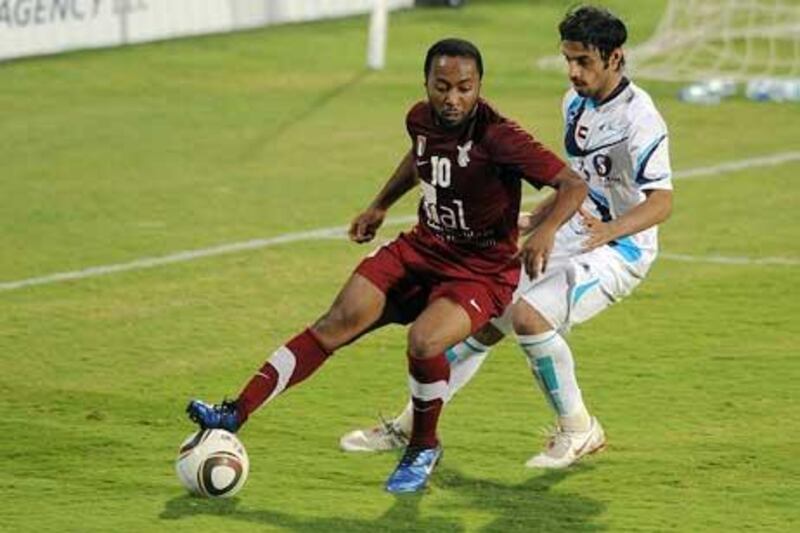 Ismail Matar, the Al Wahda forward, shields the ball while on the attack against Baniyas last night.