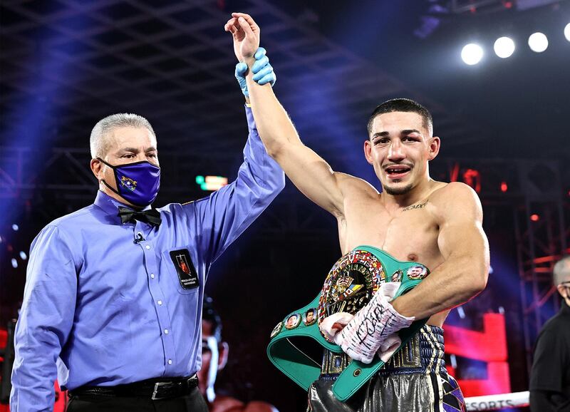 LAS VEGAS, NEVADA - OCTOBER 17: In this handout image provided by Top Rank, Teofimo Lopez Jr celebrates after defeating Vasiliy Lomachenko (not pictured) in their Lightweight World Title bout at MGM Grand Las Vegas Conference Center on October 17, 2020 in Las Vegas, Nevada. (Photo by Mikey Williams/Top Rank via Getty Images)