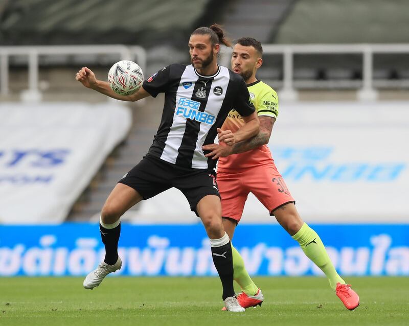 Newcastle's Andy Carroll battles for possession with Nicolas Otamendi of Manchester City. Getty